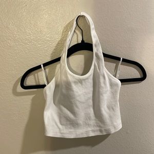 White crop top with one strap around the neck